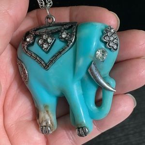 Beautiful vintage lucky sky blue elephant pendant necklace on a silver chain.